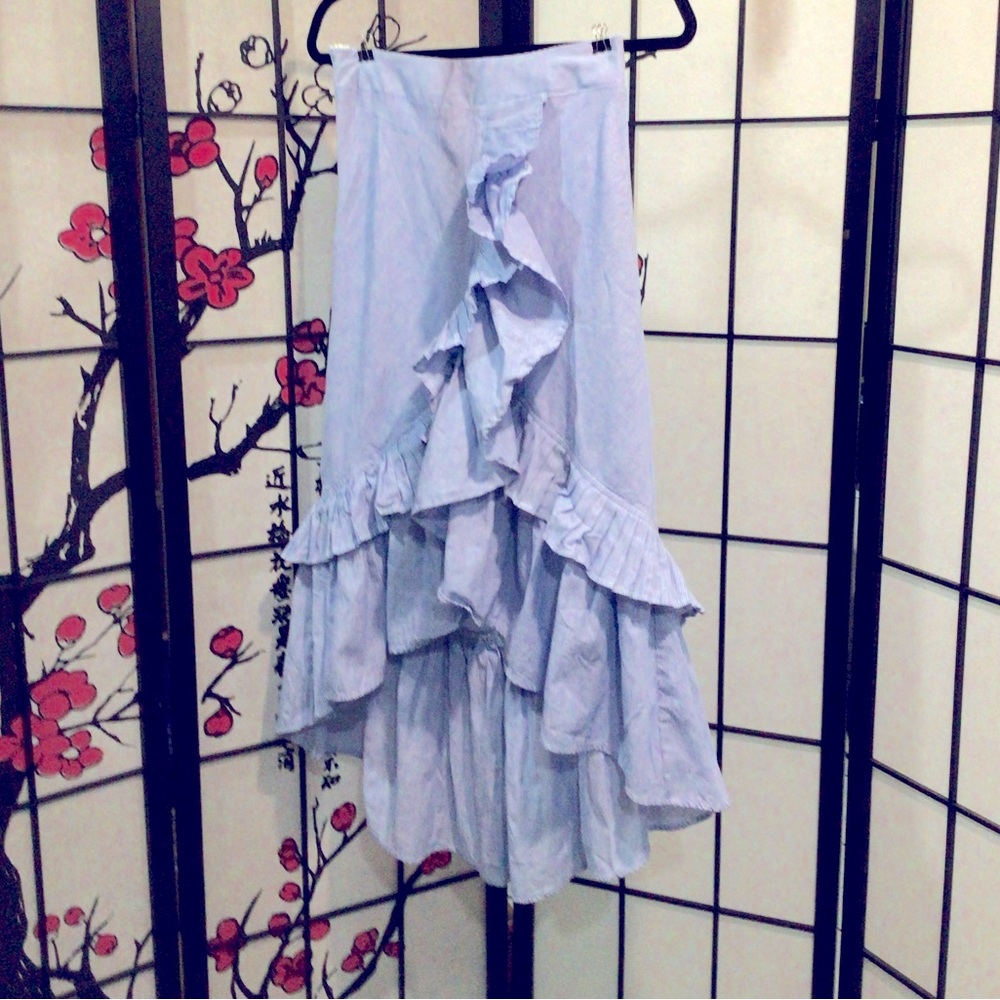 Double ruffle, hi-lo skirt with side zipper. New in original packaging  blue
